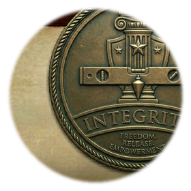 Integrity medallion: a balanced scale on a column